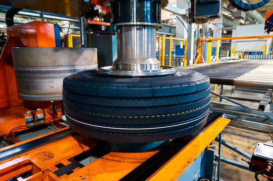 Tire with deep protector and marking on conveyor at plant