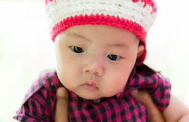 close up of cute asia baby, asia baby boy, happy baby at home