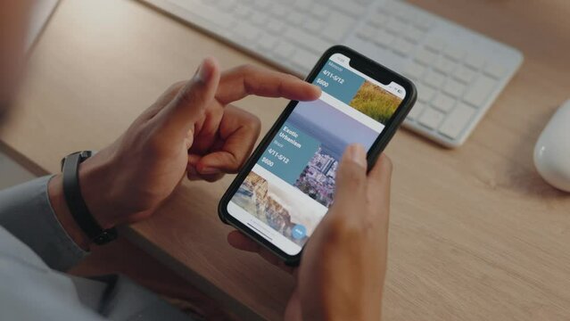 Businessman, hands or phone screen with travel app in night office for holiday booking, vacation planning or location research. Agent, worker or man on traveler technology, tourism website or planner