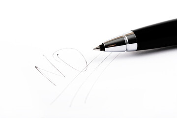 Fototapeta premium The word NO underlined three times and a black pen on a white sheet of paper