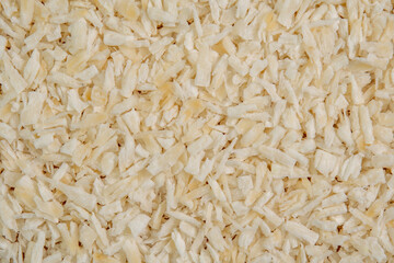 Fresh coconut flakes background. Coconut shavings or grated coconut