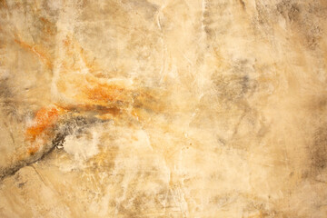 Brown background from decorative plaster with abstract spots. Unusual beige wall texture with beautiful patterns, creative surface background. Front covering for facing of buildings.