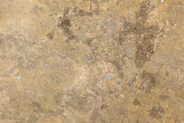 Yellow track background, yellowish concrete, concrete texture, close-up. High quality photo. Old...