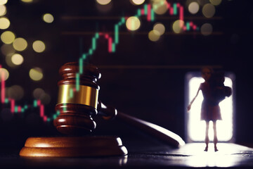 Wooden judge gavel and legal book on wooden table