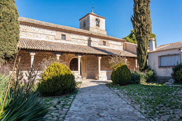 Fototapeta na wymiar Old stone church with bell tower in the medieval village of Pezuela Torres, Madrid.