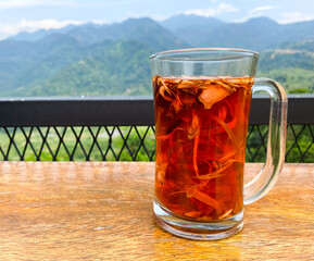 Wedang Uwuh is a traditional warm Drink with various spices at the cafe with mountain view