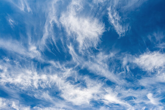 Blue sky background with awesome white clouds in the sunny day.
