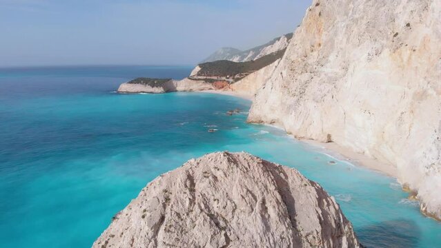 Aerial view of beautiful empty beach in Greece, no people. Dramatic coastline scenic bay rocky cliffs in the Ionian island, Port Katsiki, Lefkada. Blue turquoise waving sea.