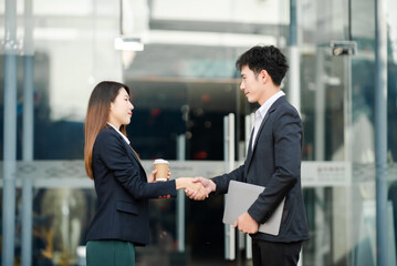 Business people shaking hands during a meeting. happy mature businessmen and woman