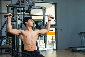 Fototapeta premium Asian man big muscle at the gym, Workout for good healthy, Body weight training,Asia men exercise chest muscle workout.