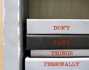 Books spine with text written - Don't Take Things Personally - stop being upset because you think...