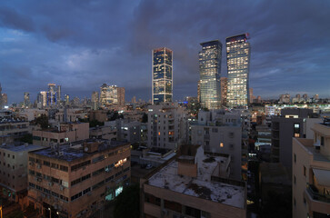 Fototapeta na wymiar Tel Aviv evening cloudy panorama: modern skyscrapers and dormitory area