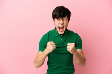 Young Russian man isolated on pink background frustrated by a bad situation