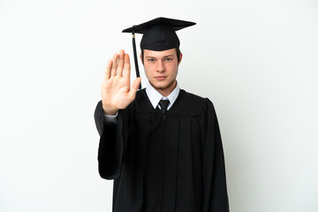 Young university Russian graduate isolated on white background making stop gesture