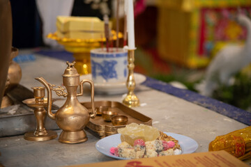 Chinese funeral religious ceremony with golden tea pot