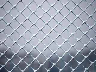 fence mesh in the snow close-up