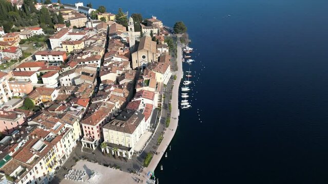 Europe, Italy, Brescia , Garda lake , Salo' drone aerial view of  village with church and lake with blue water - Italian  Republic from 1943 to 1945 during the reign of Benito Mussolini fascist 