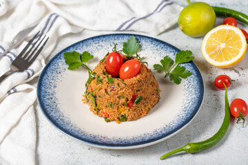 Bulgur salad on gray background. Traditional Turkish Bulgur Salad or kısır salatası