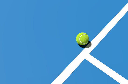 Green tennis ball on the blue court line. Tennis sport and tournament concept.