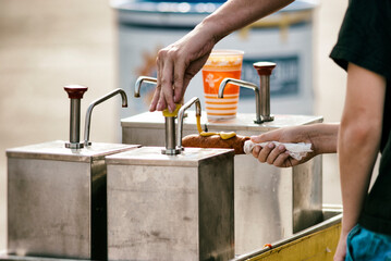 A Texas State Fair staple, the corny dog is getting the customary mustard treatment.