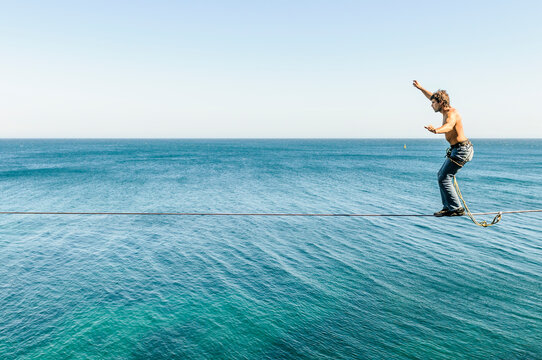 Highlining over sea at Sesimbra, Sintra, Sintra-Cascais, Portugal