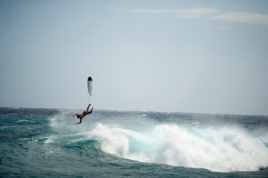 Surfer flies out the back of wave