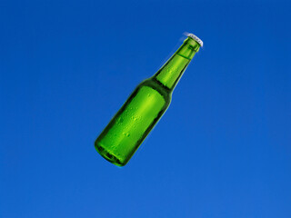 Beer bottle shot in the air with blue sky background. Beer bottle on black background with abstract lights. 3d render