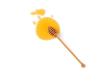 Honey with honey dipper isolated on white background. Top view.