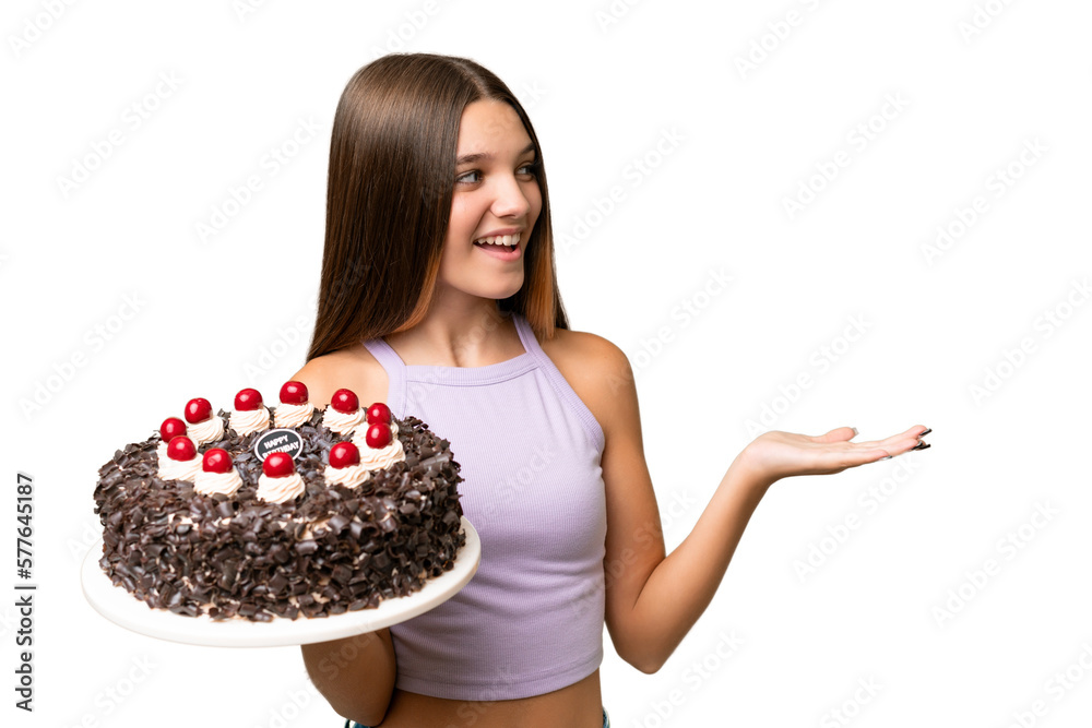 Canvas Prints Teenager caucasian girl holding birthday cake over isolated background with surprise facial expression