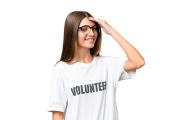 Teenager volunteer caucasian girl over isolated background smiling a lot