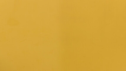 Yellow metallic background for pattern design. Yellow painted background .  Yellow surface texture Yellow galvanized iron wall texture.