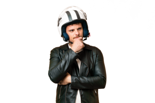 Brazilian man with a motorcycle helmet over isolated chroma key background having doubts and thinking