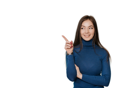 Beautiful European girl with long loose hair in a blue sweater points by  her index finger to the side, to an empty place, on transparent background looks at imaginary object. Promo, mockup, discount.