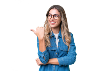 Young Uruguayan woman over isolated background pointing to the side to present a product