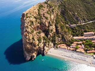 Aerial drone. Capo Calava bay and beach, with several holiday parks, resort and villages, near Gioiosa Marea, Sicily, Italy.