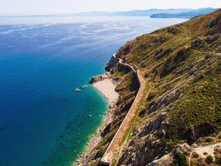 Fototapeta na wymiar Aerial drone. Capo Calava bay and beach, with several holiday parks, resort and villages, near Gioiosa Marea, Sicily, Italy.