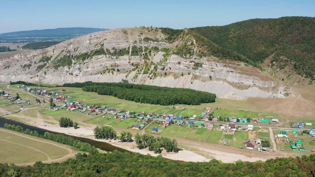 Southern Urals, Bashkiria: the Zilim River near the village of Tash-Asty, the Ukly Kaya rock, the tourist attraction Heart of Bashkiria. Aerial view.
