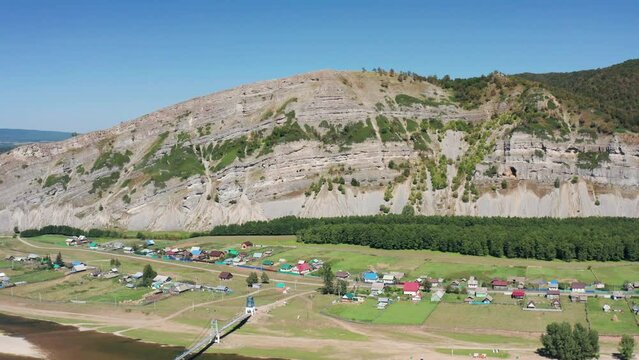 Southern Urals, Bashkiria: the Zilim River near the village of Tash-Asty, the Ukly Kaya rock, the tourist attraction Heart of Bashkiria. Aerial view.