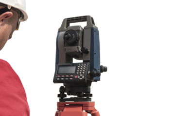 Surveyor engineer measures the level on a white isolated background. Surveyors provide accurate measurements before embarking on large construction projects.