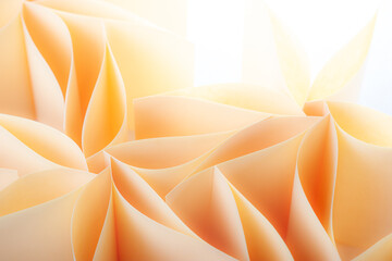 Konzept einer Papierblume im soften Focus, hell, apriko mit Platz für Text