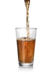 Pouring fresh juice into glass on white background