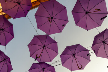 design and ornamentation of streets with purple umbrellas in place