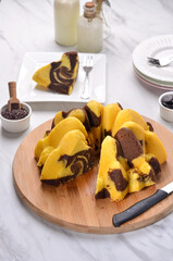 A Homemade cake made of chocolate and vanilla 
