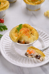 Pastel Tutup (Shepherd's Pie) is Traditional British pie. It is made from mashed potato, minced beef, mushroom, spices and herbs.
