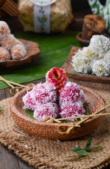 Klepon or kelepon, is a snack of sweet rice cake balls filled with molten palm sugar and coated in grated coconut.
