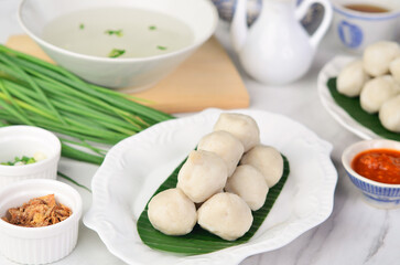 Fish balls are rounded meat balls made from fish paste which are then boiled
