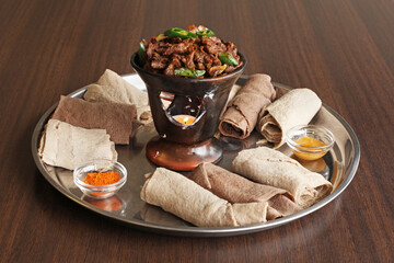Eritrean dish called Shekla, beef served with flatbread and spices