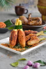 Satay Lilit is a satay from Balinese. It made from minced pork, fish, chicken, or beef meat, which is then mixed with grated coconut, thick coconut milk, lemon juice, shallots, and pepper. 
