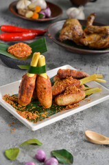 Satay Lilit is a satay from Balinese. It made from minced pork, fish, chicken, or beef meat, which is then mixed with grated coconut, thick coconut milk, lemon juice, shallots, and pepper. 
