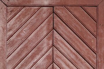 Fototapeta premium Red painted boards, close up. Wood texture. Natural wood background. Old board, faded paint